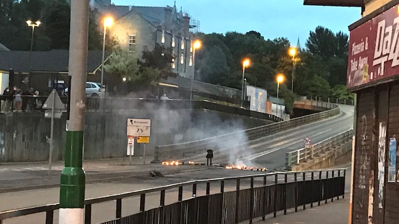A fire at the bottom of the flyover in the Bogside after youths armed with petrol bombs and stones threw missiles into the nearby unionist Fountain estate&nbsp;