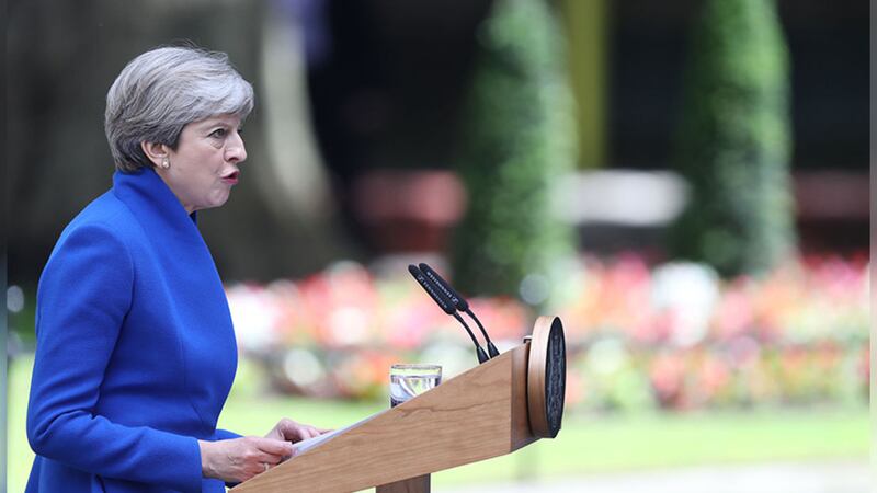 British Prime Minister Theresa May makes a statement in Downing Street after she travel'ed to Buckingham Palace for an audience with the queen following the General Election results. Picture by Andrew Matthews/PA Wire&nbsp;