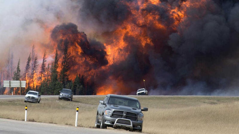 A wildfire burns south of Fort McMurray, Alberta, near Highway 63 in Canada earlier this month. Wildfires in the North American country have pushed Brent crude prices up to US$49 a barrel PICTURE: Jonathan Hayward/The Canadian Press/AP 