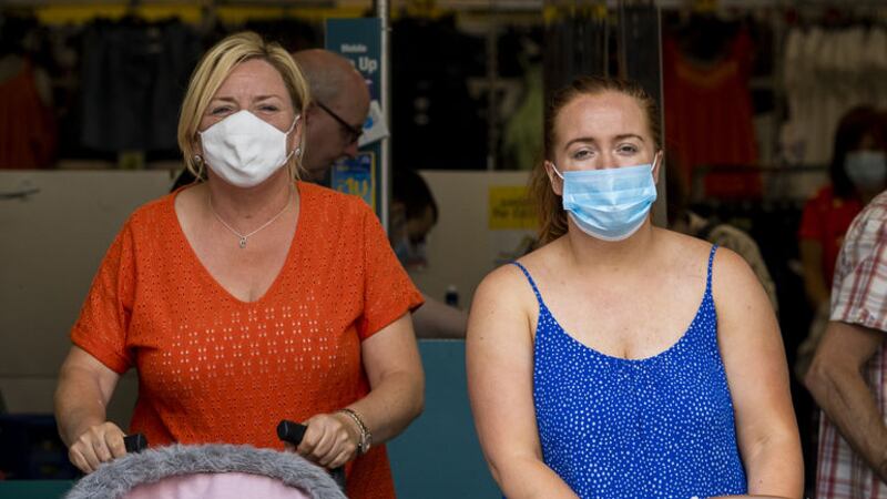 &nbsp;Customers wearing face masks leave Poundland in Belfast as face coverings are now compulsory for shoppers in Northern Ireland.