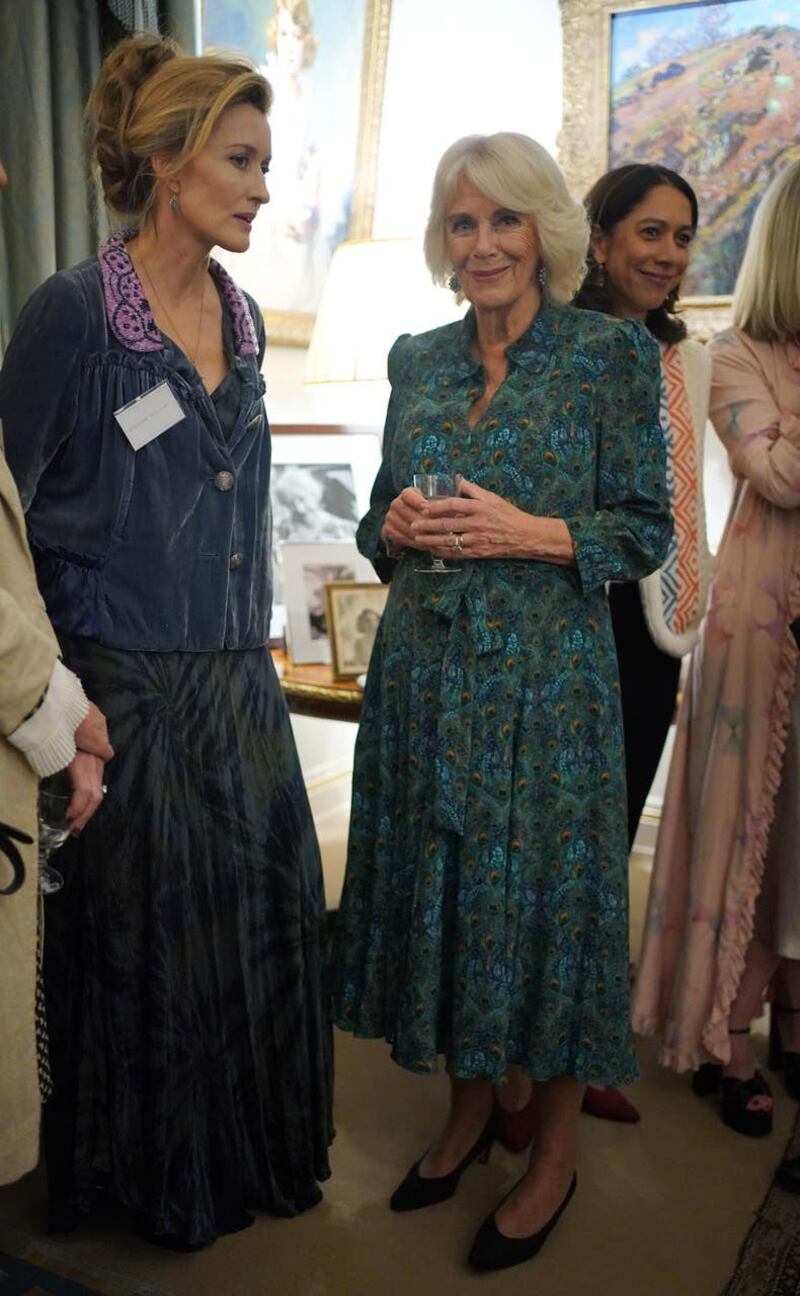 The Queen (right) meets Natascha McElhone during the reception 