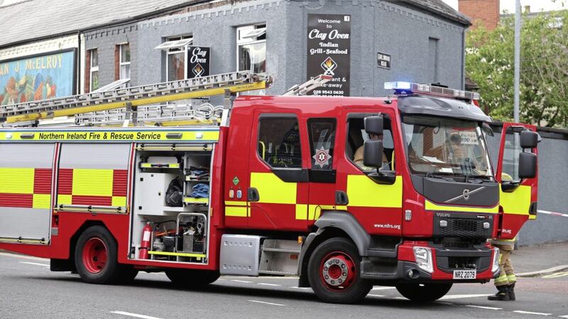 Fire crews at the scene of a gas explosion at a newly opened Indian restaurant on the Newtownards Road in east Belfast. Picture Mal McCann. 
