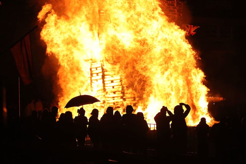 Crowds watch as a bonfire is lit in New Lodge, north Belfast. Picture by&nbsp;PA Wire&nbsp;