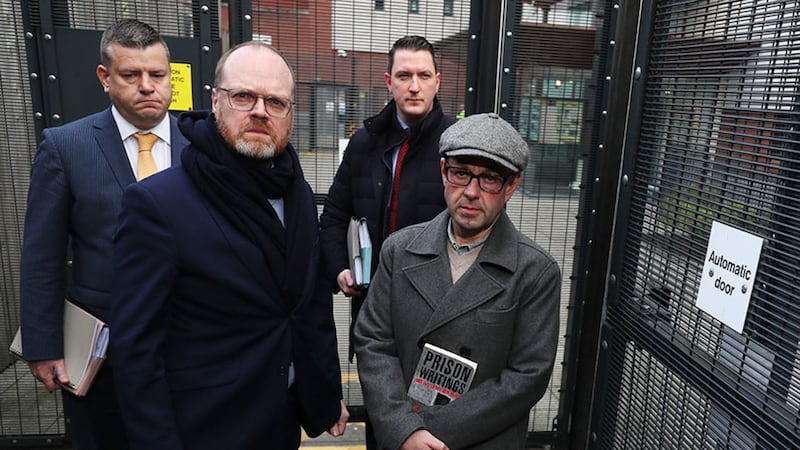 Journalists Barry McCaffrey (front right) and Trevor Birney (centre) and their solicitors arrive at Musgrave Street PSNI station in Belfast last month for scheduled questioning over the alleged theft of Police Ombudsman documentation on the Loughinisland massacre. Picture by Brian Lawless, PA Wire