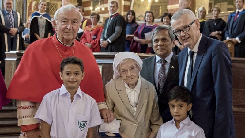 Cardinal Vincent Nichols, Sr Berchmans, HE High-Commissioner Muhammad Naseem Zaharia, and Adrian O&#39;Neill joined by two former pupils at the presentation of the Benedict Medal 