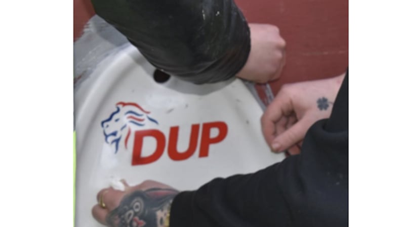A urinal featuring the logo of the DUP made a brief appearance in the Holyland area of Belfast this week before being destroyed.