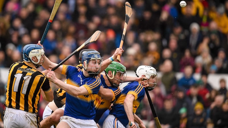 Kilkenny's T.J Reid and Joey Holden in action against, from left, Tomas Hamill, Cathal Barrett and Michael Cahill, Tipperary. &nbsp;Picture: Ray McManus / SPORTSFILE&nbsp;