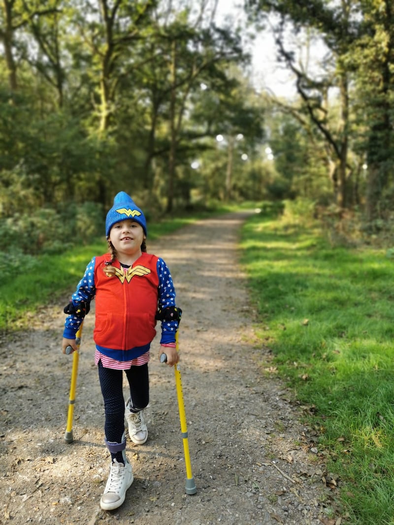 Carmela walks with the aid of sticks (Muscular Dystrophy UK/PA).