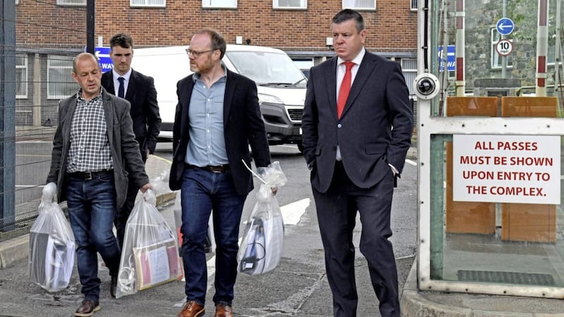 Journalists Trevor Birney and Barry McCaffrey, with their legal team, leave Castlereagh Police Station in east Belfast after having all the materials and computers seized by the PSNI returned to them. Picture by Alan Lewis 