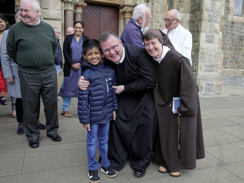 Fr Noel Kehoe, the outgoing Rector of Clonard, is greeted by Massgoers yesterday before he leaves for a new role in Dundalk. Picture: Ann McManus 