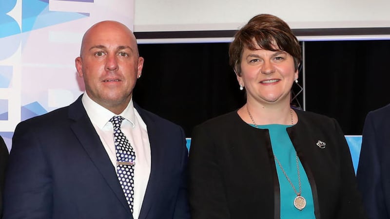 Self confessed UDA commander Dee Stitt, who is also the CEO of Charter NI, along with First Minister Arlene Foster 