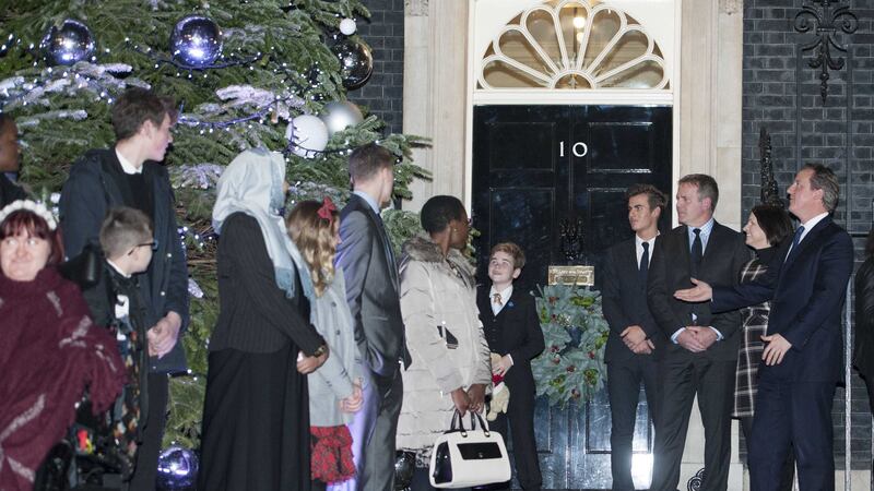 Prime Minister David Cameron attends the switching on of the Downing Street Christmas tree lights with Michaela Hollywood, far left. Picture by Lauren Hurley, PA Wire&nbsp;