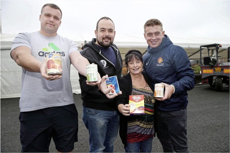 Ardoyne and Marrowbone festival committee Stephen Konrad, Paul McCusker, Marie McKee and Gareth Gilvary at the Flax Centre Pavilion, those attending are asked to donate items to the local food bank. Picture by Hugh Russell. 