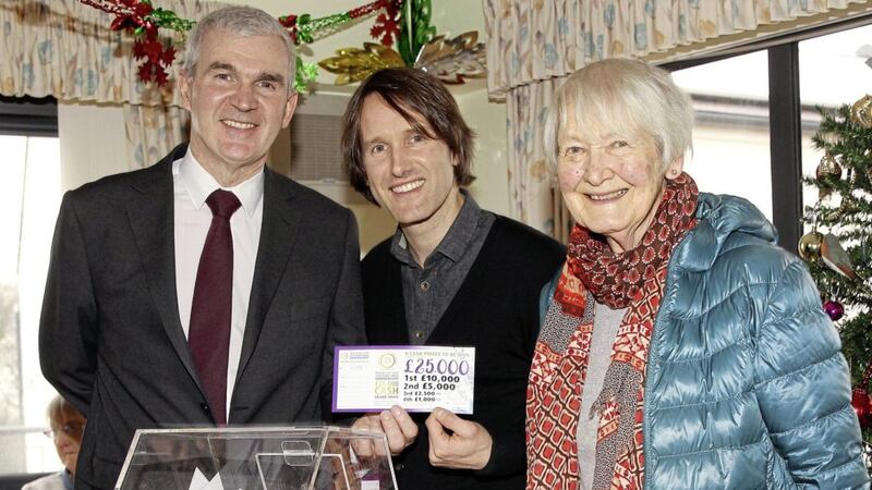 Singer-songwriter Tim Wheeler, frontman of Downpatrick rock band Ash, picked out the prize-winning tickets for a &pound;25,000 draw at Mainstay DRP&#39;s 25th Anniversary celebrations in his home town earlier this month. With him are his mother and Brain Connor of Danske Bank Picture: Philip Walsh 