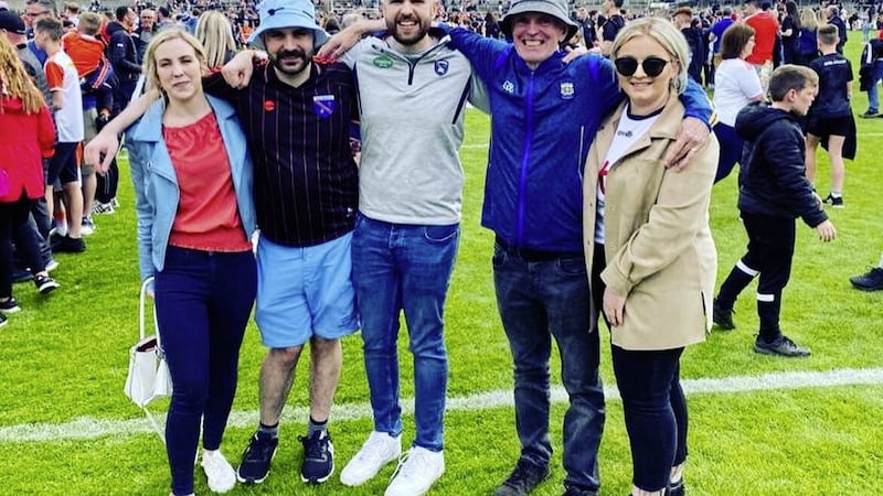 Natalie (left) and the McNally family on the pitch at the Athletic Grounds after Armagh played Tyrone on June 5 last year 
