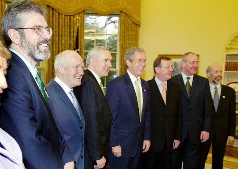 President Bush in the Oval Office with leaders who went to Washington DC for St Patrick's Day, pictured on Wednesday March 13 2002. From left to right, President of Sinn Féin Gerry Adams, Secretary of State John Reid, Taoiseach Bertie Ahern, President Bush, First Minister David Trimble, SDLP leader Mark Durkan, Alliance David Ford.  (AP Photo/Doug Mills)