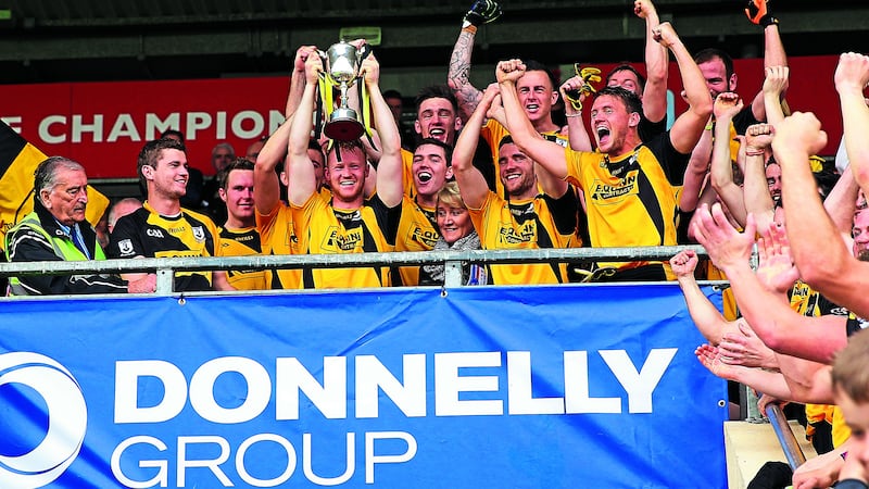 Pomeroy hoist the trophy aloft after winning their fourth Tyrone IFC title at Healy Park yesterday.&nbsp;Picture by Philip Walsh