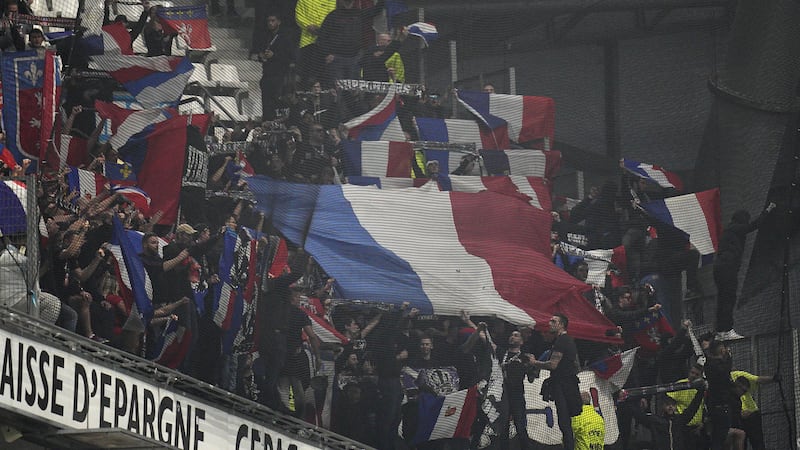Lyon fans in the stadium (Daniel Cole/AP)