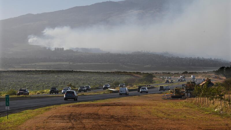 Smoke blows across the slope of Haleakala volcano on Maui, Hawaii (Matthew Thayer/The Maui News via AP)