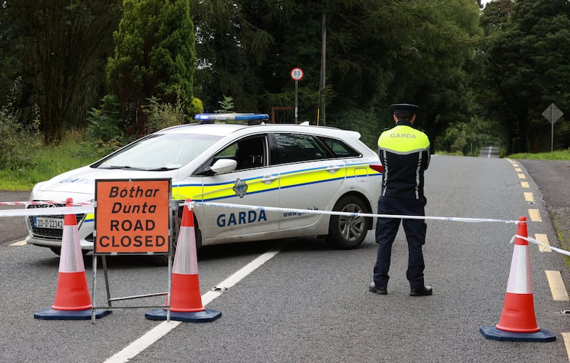 A Garda officer stands on Tuesday at the closed N54 outside Clones, Co. Monaghan.  Picture, Liam McBurney/PA Wire