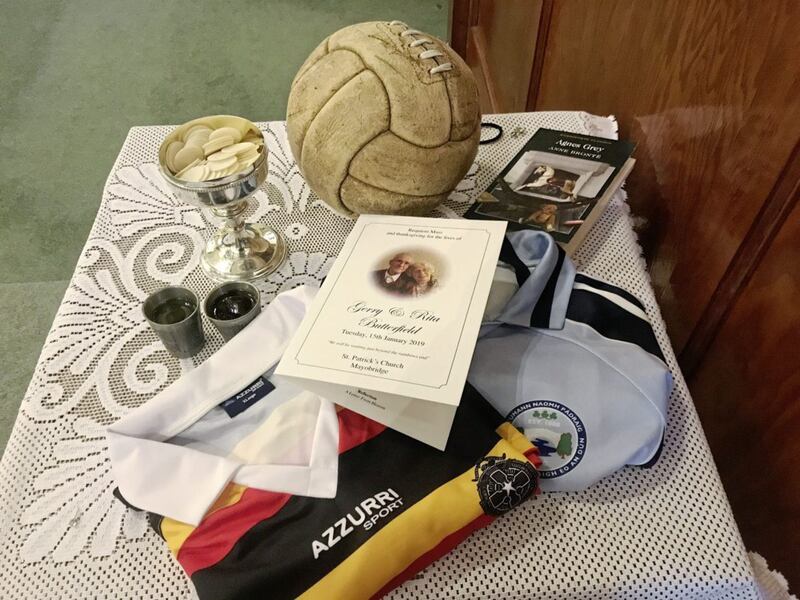 Offerings at the funeral of Gerry and Rita Butterfield include an Abbey CBS and Mayobridge Jersey and an original GAA ball from the 1950s. Picture by Mal McCann.
