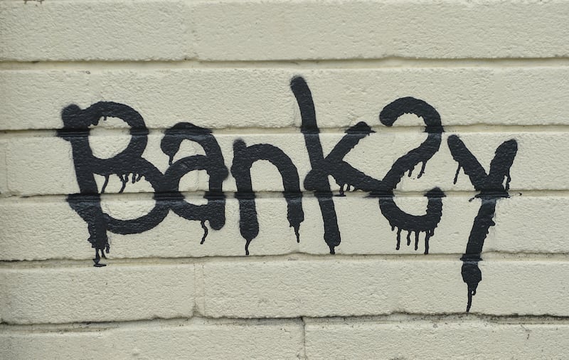 A Banksy signature on a mural (Ben Birchall/PA)