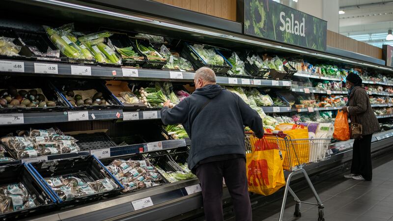 Shoppers in the fruit and vegetables section of a branch of Sainsbury’s