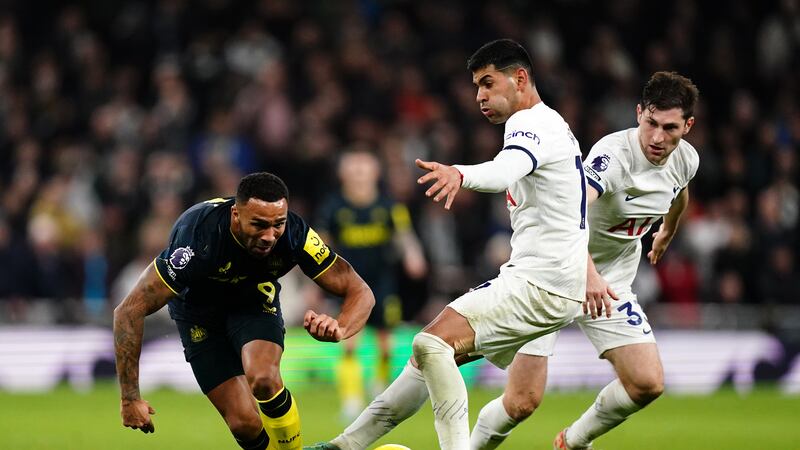 Newcastle’s Callum Wilson is tackled by Tottenham centre-back Cristian Romero