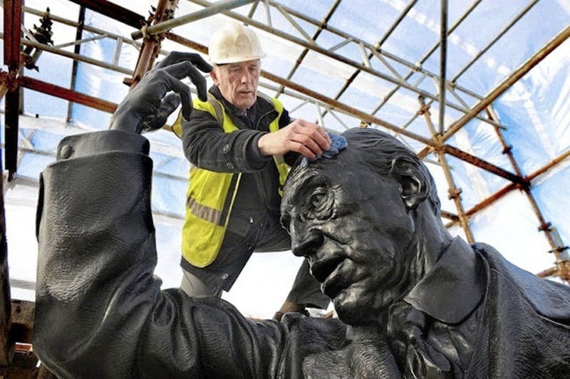John Sherlock working on the restoration of the statue of Lord Carson at Parliament Buildings, Stormont 
