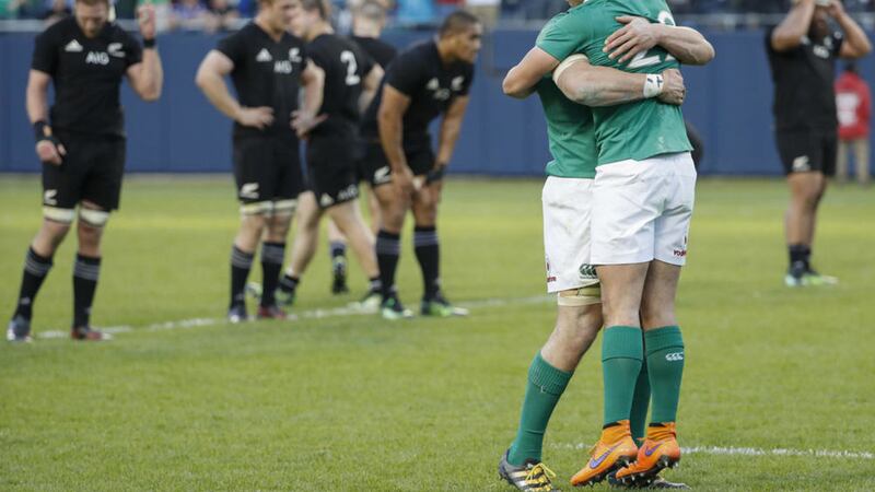 Ireland&#39;s Joey Carbery, right, celebrates with Josh van der Flier, left, after the historic victory over New Zealand 