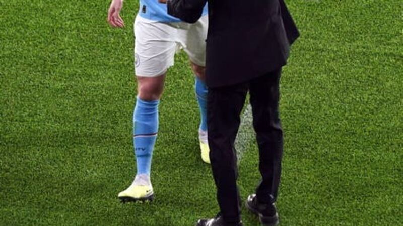 Kevin De Bruyne is consoled by manager Pep Guardiola as he walks off injured (Mike Egerton/PA).