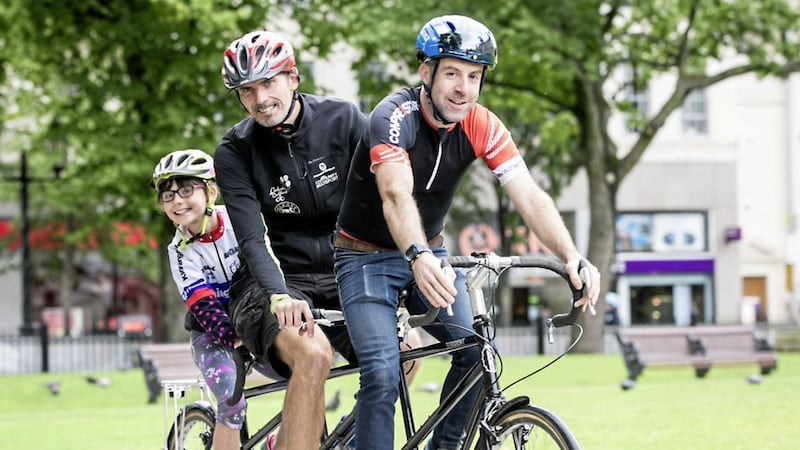 Emer Heverin (8), Gerry Heverin and Richard Bradley help to launch the third Ciclovia Belfast, taking place on September 24 