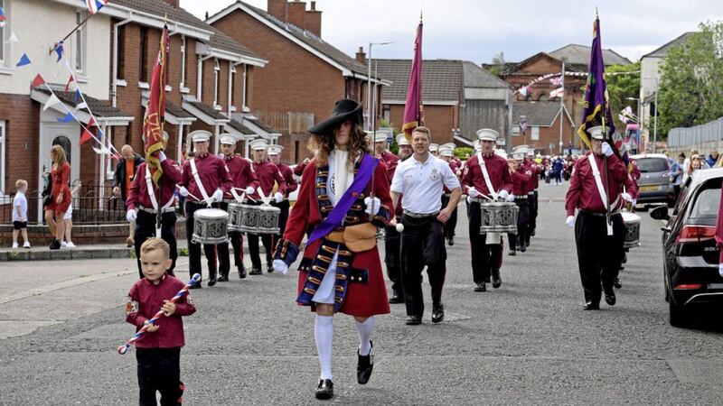 The Shankill Protestant Boys Flute Band marching around their local area yesterday 