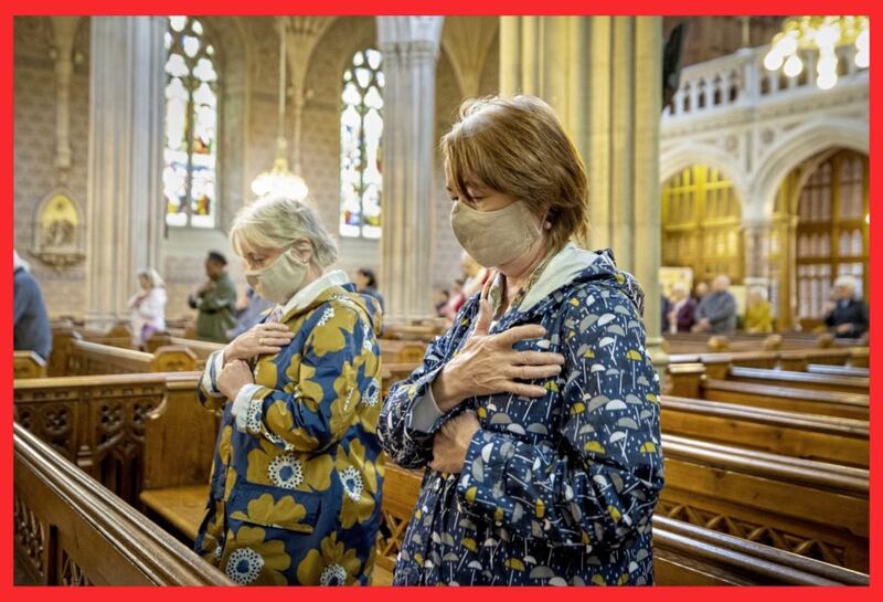 Parishioners wearing face masks bless themselves at the end of Mass at St Patrick&#39;s Catholic Cathedral in Armagh. Picture by Liam McBurney/PA Wire 