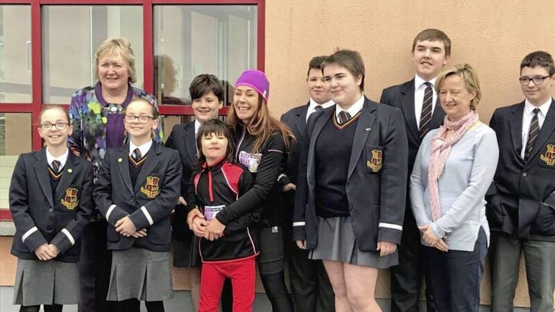 Billy Caldwell and his mother Charlotte with pupils at Castlederg High School who are supporting &lsquo;Billy&rsquo;s Cannabis Walk&rsquo; 
