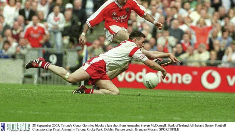 Tyrone&#39;s Conor Gormley blocks a late shot from Armagh&#39;s Steven McDonnell in the 2003 All-Ireland Senior Football Championship final. Picture credit; Brendan Moran / SPORTSFILE. 