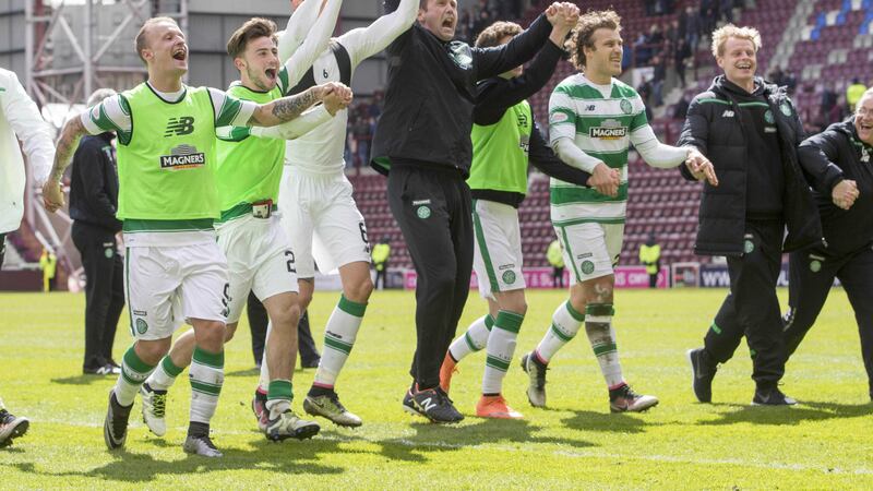 Celtic manager Ronny Deila and his team celebrate in front of their fans at the end of Saturday's Ladbrokes Scottish Premiership match against Hearts at Tynecastle&nbsp;<br />Picture by PA