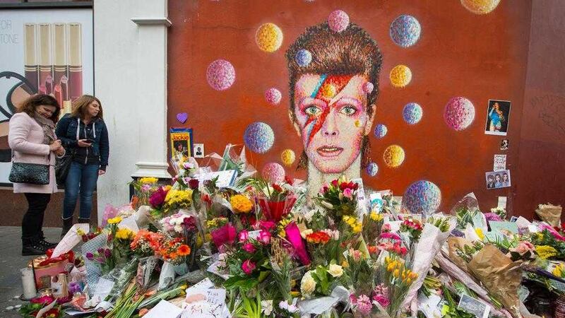 Floral tributes at a Bowie mural in London last week 