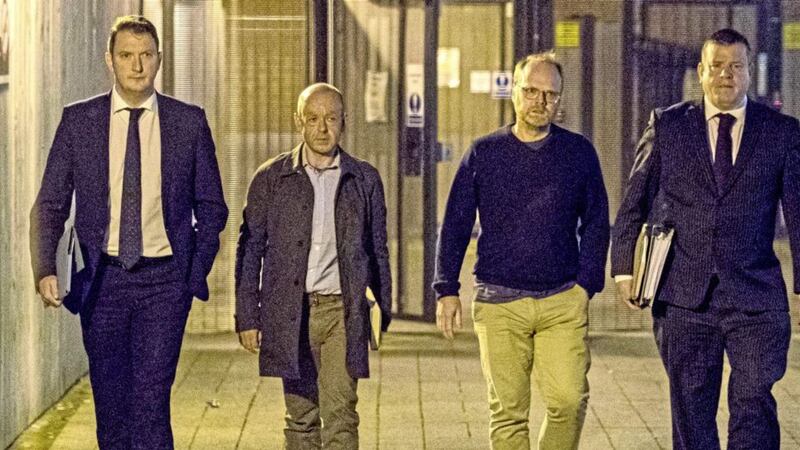 (Left to right) Solicitor John Finucane with journalistBarry McCaffrey and Trevor Birney with his solicitor Niall Murphy leaving Musgrave police station in Belfast. Picture by Liam McBurney, Press Association