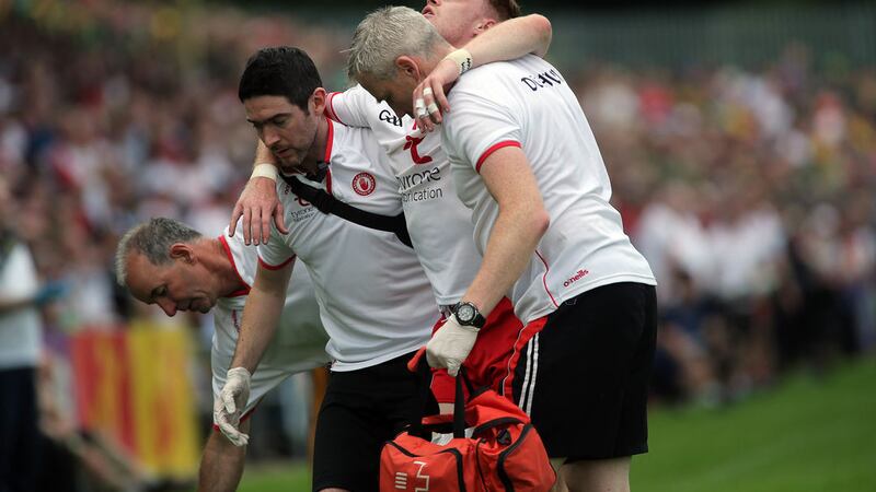 BAD BREAK: Conor Meyler is helped off the MacCumhaill Park pitch after fracturing his tibia against Donegal last month. The Omagh man recovered to line&nbsp;out in Sunday&rsquo;s All-Ireland final defeat to Dublin. Picture: Seamus Loughran&nbsp;
