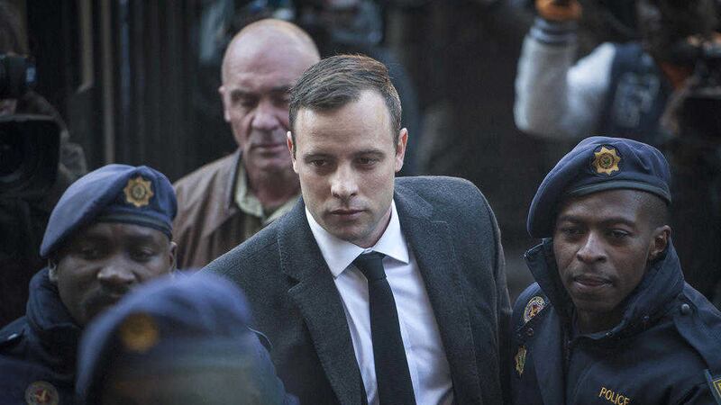 Oscar Pistorius, centre, arrives at the High Court in Pretoria, South Africa, for a sentencing hearing for the murder of his girlfriend Reeva Steenkamp. Picture by Shiraaz Mohamed, Associated Press