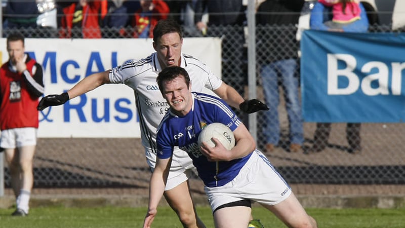 Coalisland&rsquo;s Peter Donnelly is challenged by Clonoe&rsquo;s Patrick Doris during yesterday&rsquo;s Tyrone SFC semi-final in Dungannon&nbsp;