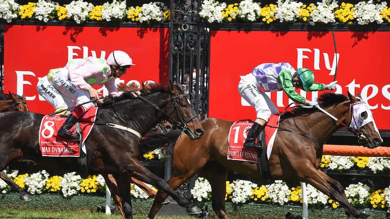 Prince Of Penzance, right with jockey Michelle Payne on board wins the Melbourne Cup, ahead of Max Dynamite ridden by Frankie Dettori, left  at Flemington Racecourse in Melbourne, Australia. Picture by Andy Brownbill 