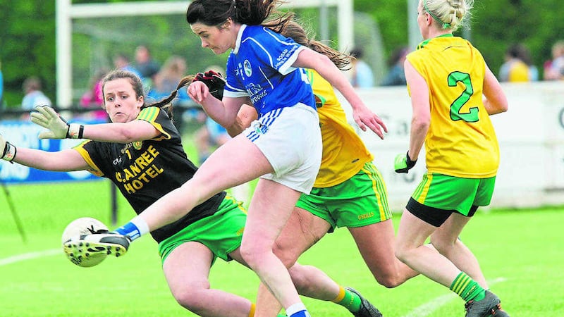 Amy Rooney slots the ball past Donegal 'keeper Aoife McColgan to score Cavan's goal