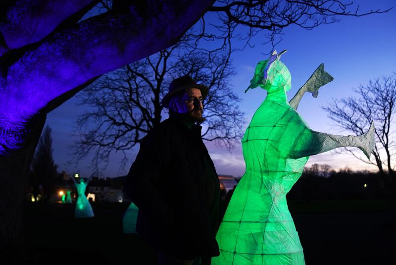 Tom Meskell, community engagement artist, with his exhibition Silva Lumina Lights Of Growth