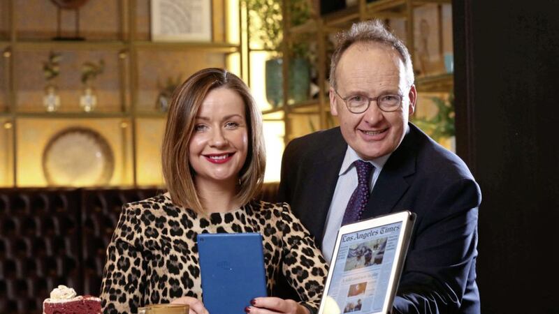 Managing director of Hastings Hotels, Howard Hastings (right), samples the PressReader services with Grand Central guest, Sinead McKay. Picture by William Cherry 