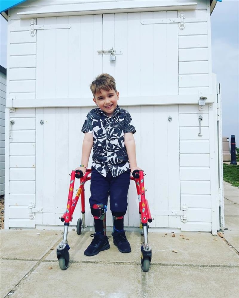 <strong>WALKING TALL:</strong>&nbsp;Inspirational Harry Ragless has raised &pound;2,400 with the help of his father, his walking frame and leg supports&nbsp;
