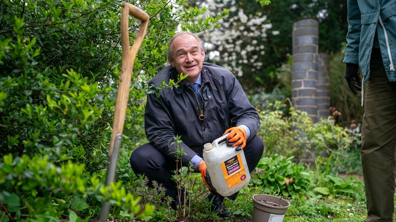 Liberal Democrat leader Sir Ed Davey waters a tree he planted during a visit to Hillfield Gardens in Gloucester to meet volunteers who dedicate their time to gardening, pond cleaning and ensuring the community gardens are well-maintained