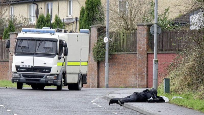 Army bomb disposal officers at the scene of the alert at the Brians Well Road area of Poleglass. Picture by Ann McManus. 