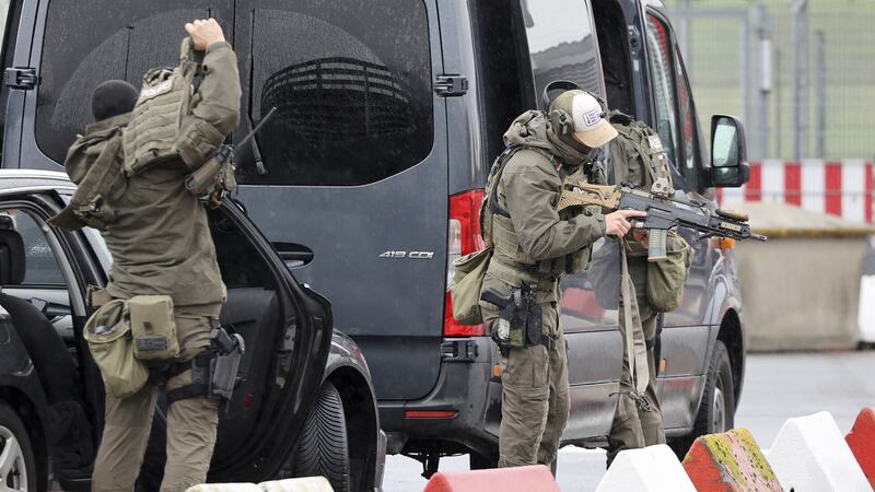 Armed police at Hamburg airport where a man was holding his four-year-old daughter hostage as part of a custody dispute (Bodo Marks/dpa/AP)